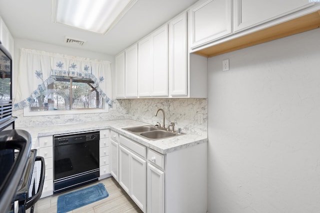 kitchen featuring sink, dishwasher, range, white cabinetry, and decorative backsplash