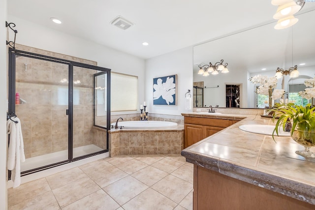 439 Cherry Blossom Loop, Richland, WA 99352 - full bathroom with a shower stall, a bath, tile patterned floors, vanity, and a spacious closet