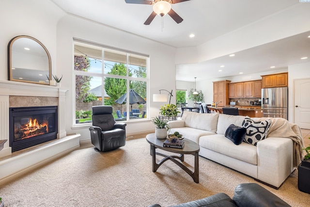 439 Cherry Blossom Loop, Richland, WA 99352 - living area with recessed lighting, ceiling fan, a glass covered fireplace, and carpet