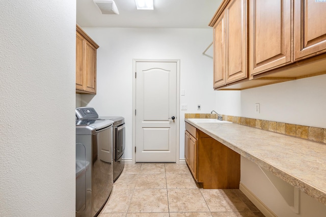 439 Cherry Blossom Loop, Richland, WA 99352 - washroom featuring washing machine and dryer, cabinet space, and light tile patterned flooring
