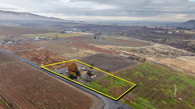 drone / aerial view featuring a mountain view and a rural view