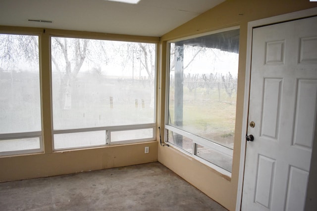 unfurnished sunroom with plenty of natural light and lofted ceiling