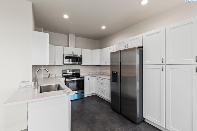 kitchen featuring sink, stainless steel appliances, and white cabinets