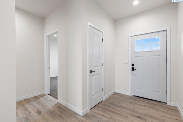 entryway with light hardwood / wood-style flooring