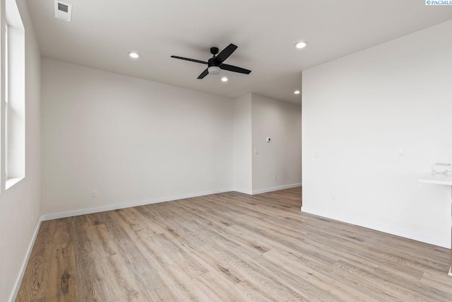 spare room featuring ceiling fan and light wood-type flooring