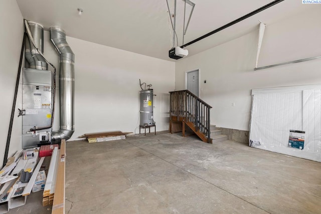 garage featuring a garage door opener and water heater