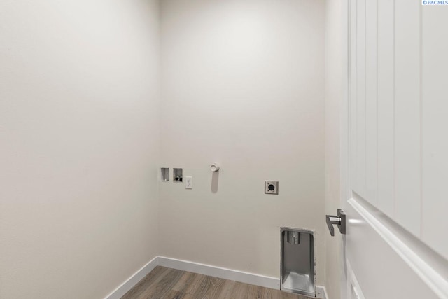 washroom with wood-type flooring, hookup for an electric dryer, and hookup for a washing machine