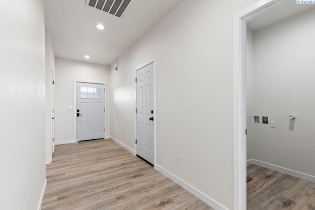 hall with light hardwood / wood-style floors