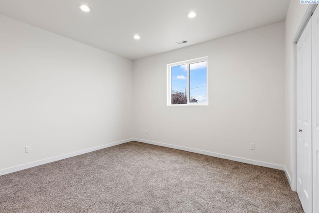 unfurnished bedroom with carpet flooring and a closet