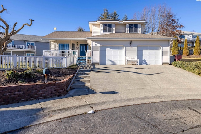 view of property featuring a garage and covered porch