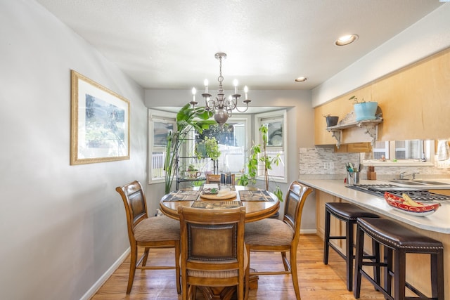 485 NW Thomas St, Pullman, WA 99163 - dining room with a chandelier, light wood-style floors, baseboards, and recessed lighting