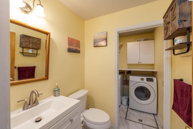 485 NW Thomas St, Pullman, WA 99163 - half bathroom with washer / dryer, marble look tiles, toilet, and vanity