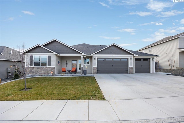 view of front of house featuring a garage, a front yard, concrete driveway, and stone siding