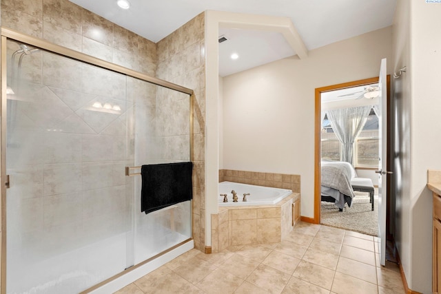 bathroom featuring tile patterned flooring, plus walk in shower, and vanity