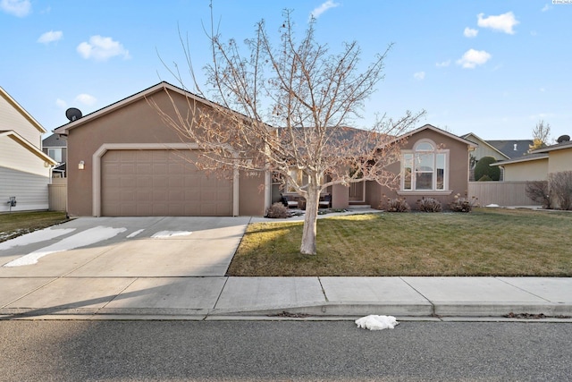 ranch-style house featuring a garage and a front lawn