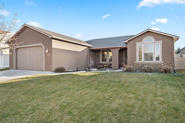 ranch-style house with a garage and a front lawn