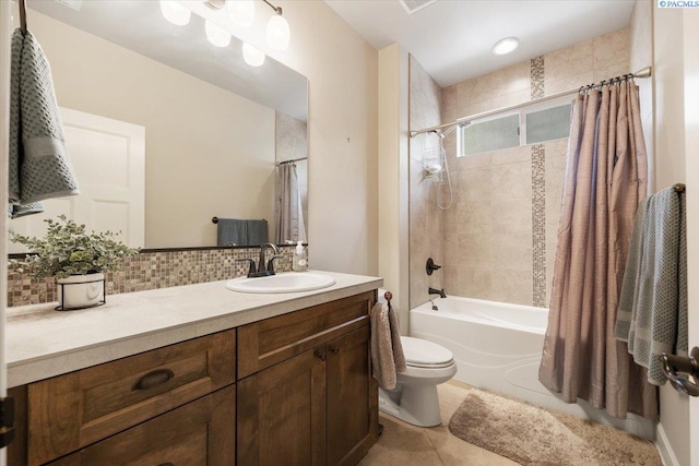 full bathroom featuring toilet, tasteful backsplash, shower / tub combo, vanity, and tile patterned flooring