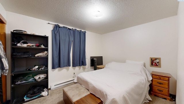 938-940 SW Cityview, Pullman, WA 99163 - bedroom featuring a baseboard heating unit, carpet floors, and a textured ceiling