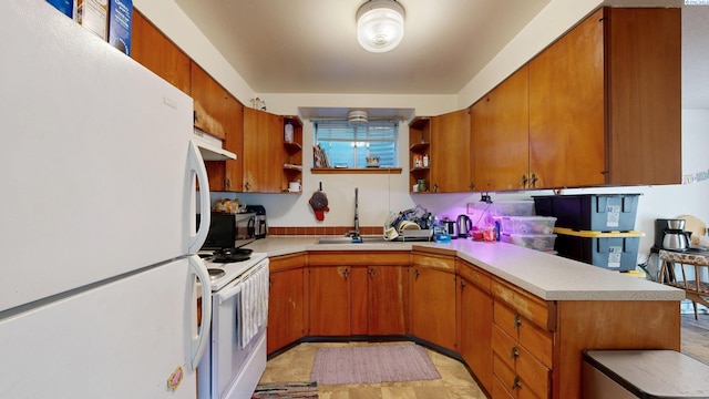 938-940 SW Cityview, Pullman, WA 99163 - kitchen featuring white appliances, open shelves, a sink, and light countertops