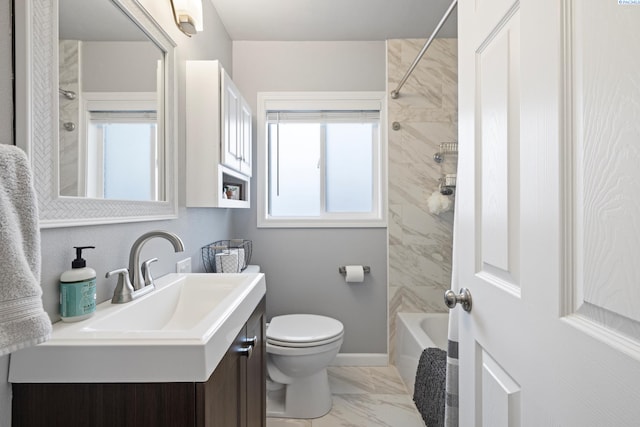 full bath featuring toilet, marble finish floor, a wealth of natural light, and vanity