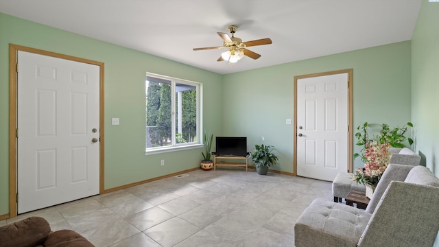 505 Armas Ct, Grandview, WA 98930 - living area featuring baseboards, a ceiling fan, and light tile patterned flooring