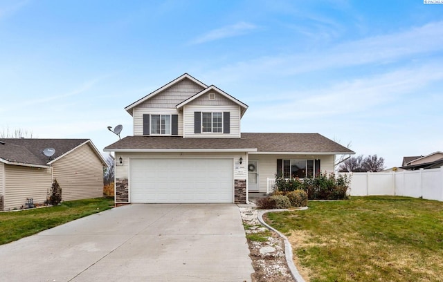 view of front of house with a garage and a front yard