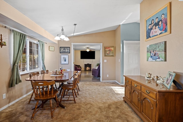 dining room with light carpet and lofted ceiling