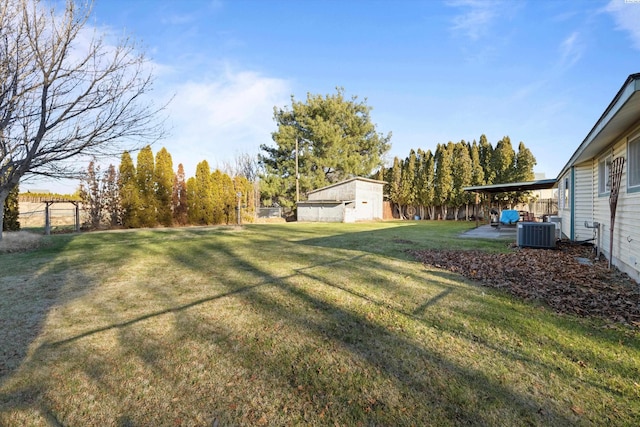 view of yard with central AC