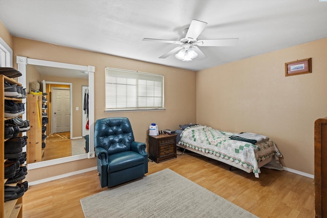 bedroom featuring ceiling fan and light hardwood / wood-style floors