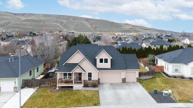 birds eye view of property with a mountain view