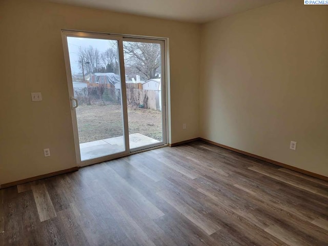 unfurnished room with wood-type flooring