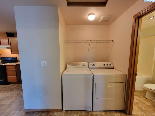 laundry area featuring independent washer and dryer