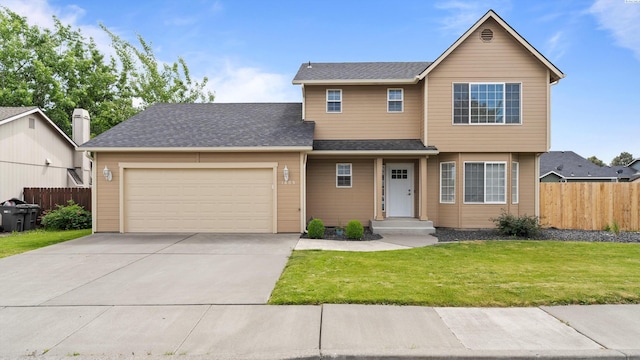 view of front of property with a garage and concrete driveway