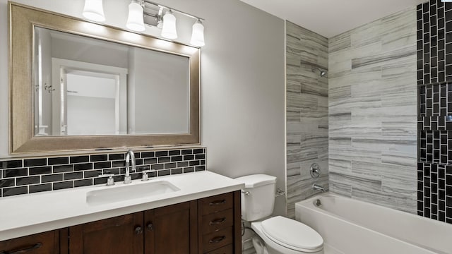 bathroom with backsplash, toilet, vanity, and shower / bathtub combination