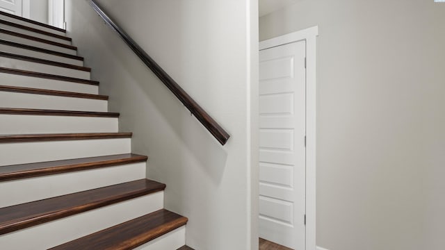 stairs with wood finished floors