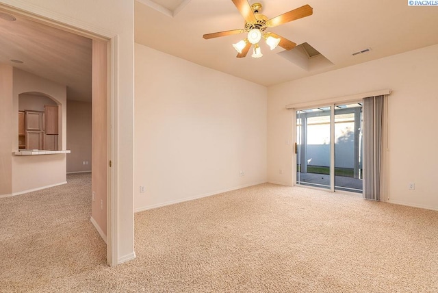 carpeted empty room with visible vents, ceiling fan, and baseboards