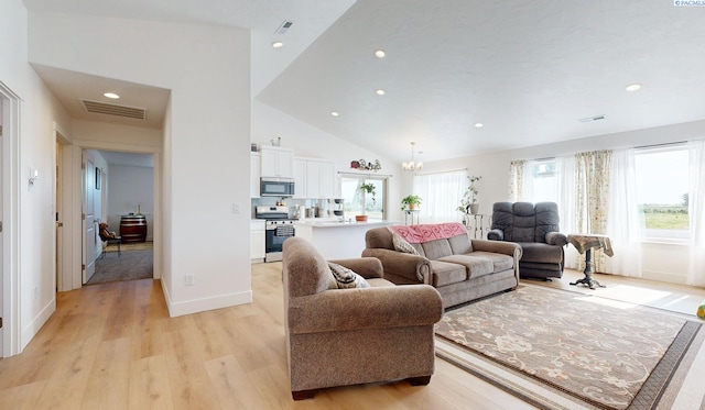 1609 Diamond Ave, Grandview, WA 98930 - living room with a chandelier, light wood finished floors, recessed lighting, and high vaulted ceiling