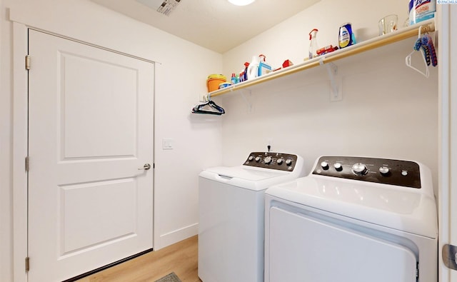 1609 Diamond Ave, Grandview, WA 98930 - laundry room featuring separate washer and dryer and light wood-style floors