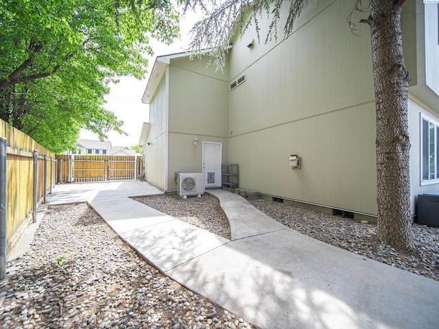 612 S Young St, Kennewick, WA 99336 - view of property exterior featuring a cooling unit, a patio area, and a fenced backyard