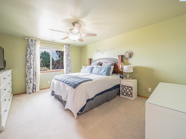 612 S Young St, Kennewick, WA 99336 - bedroom with light carpet, baseboards, and ceiling fan
