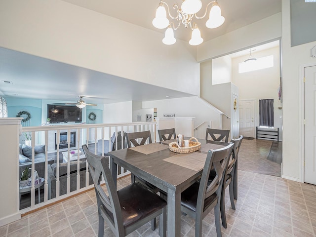 612 S Young St, Kennewick, WA 99336 - dining space with a chandelier, a ceiling fan, and a high ceiling