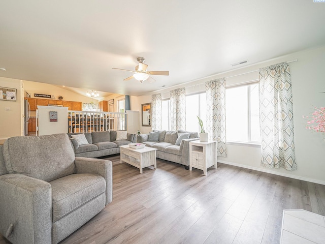 612 S Young St, Kennewick, WA 99336 - living room with light wood finished floors, a ceiling fan, and baseboards