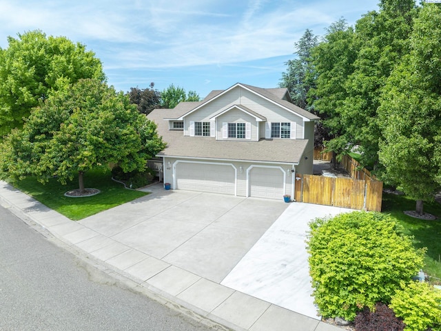 612 S Young St, Kennewick, WA 99336 - traditional-style home with an attached garage and driveway