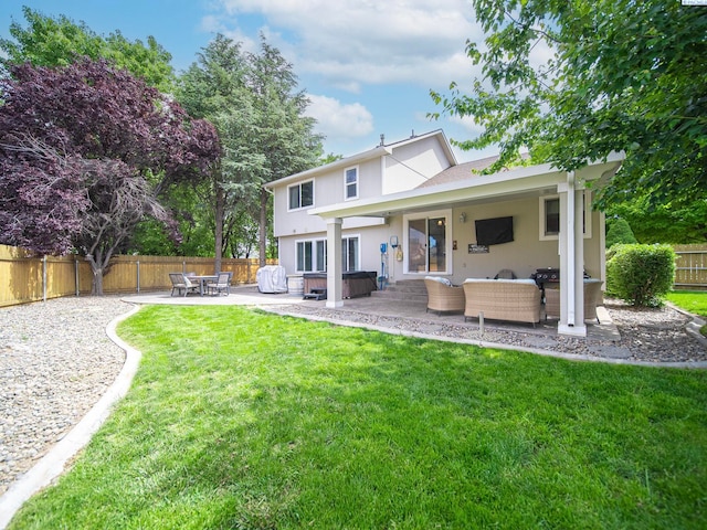 612 S Young St, Kennewick, WA 99336 - rear view of house with a patio area, an outdoor living space, and stucco siding