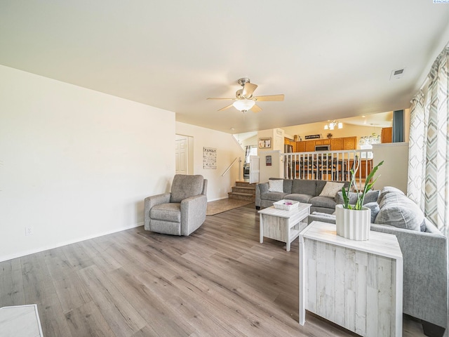 612 S Young St, Kennewick, WA 99336 - living room with stairway, wood finished floors, ceiling fan, and baseboards