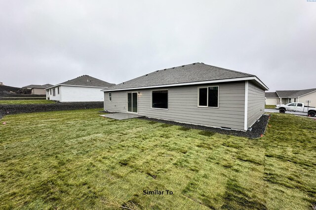 6665 W 29th Ct, Kennewick, WA 99338 - rear view of house with a lawn and a patio