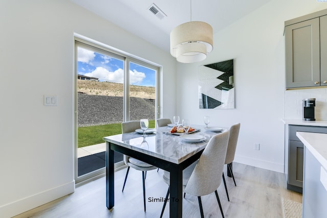 6665 W 29th Ct, Kennewick, WA 99338 - dining area with light wood-style floors and baseboards