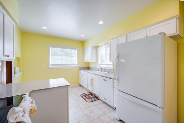 912 S Lake St, Colfax, WA 99111 - kitchen with white appliances, white cabinets, light floors, light countertops, and recessed lighting