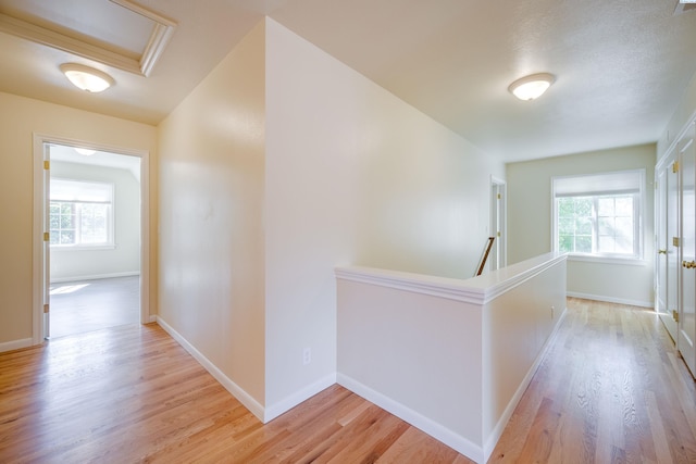 912 S Lake St, Colfax, WA 99111 - hall with an upstairs landing, light wood-type flooring, and attic access