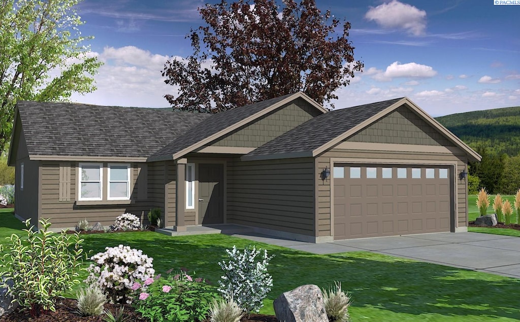 503 Van Way, Grandview, WA 98930 - view of front of house featuring an attached garage, a front lawn, and concrete driveway